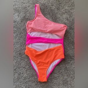 Pink lily cut out swimsuit. Size medium. Worn once. Bright colors.